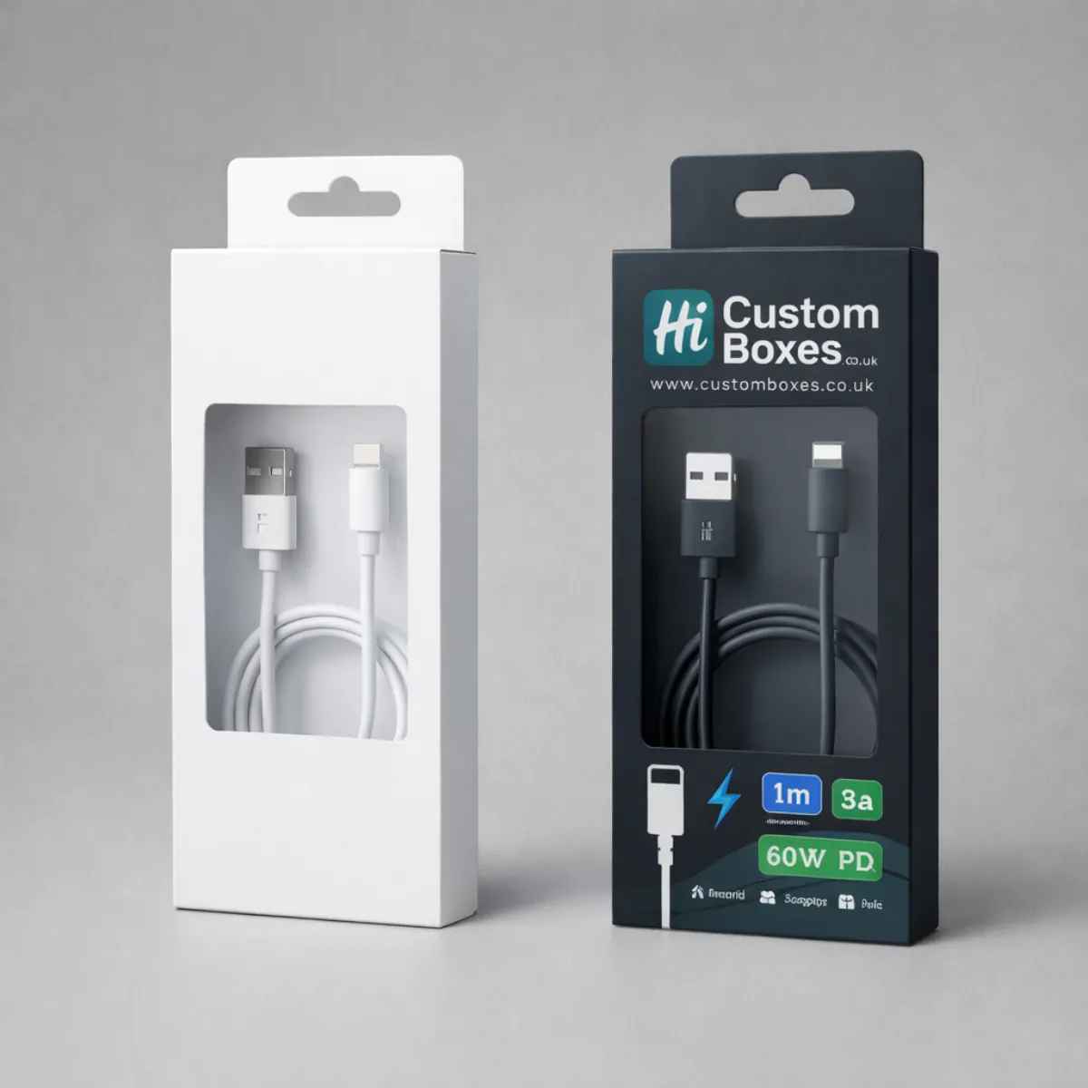 Two retail boxes featuring rectangular cut-out windows displaying coiled USB cables inside, with hanging tabs. class=